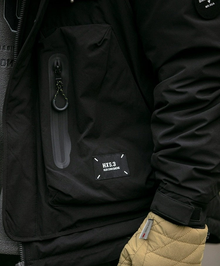 Oversized corduroy hooded down jacket in black and brown colorways with multi-pocket design