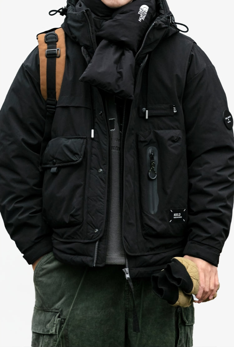 Oversized corduroy hooded down jacket in black and brown colorways with multi-pocket design