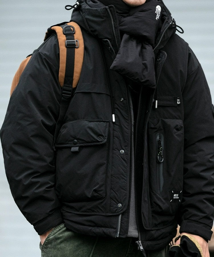 Oversized corduroy hooded down jacket in black and brown colorways with multi-pocket design