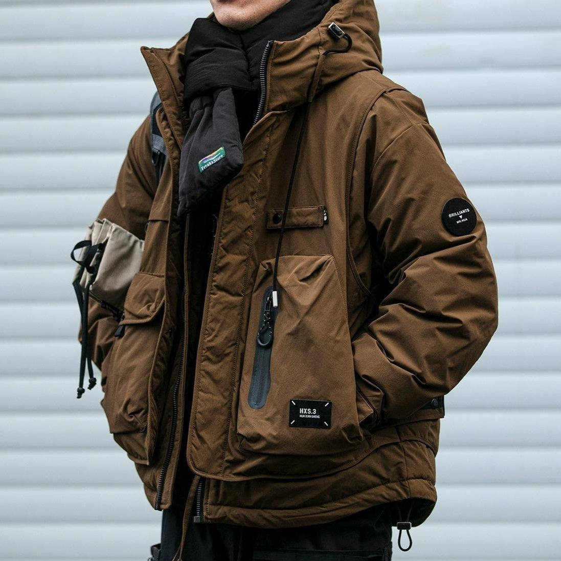 Oversized corduroy hooded down jacket in black and brown colorways with multi-pocket design