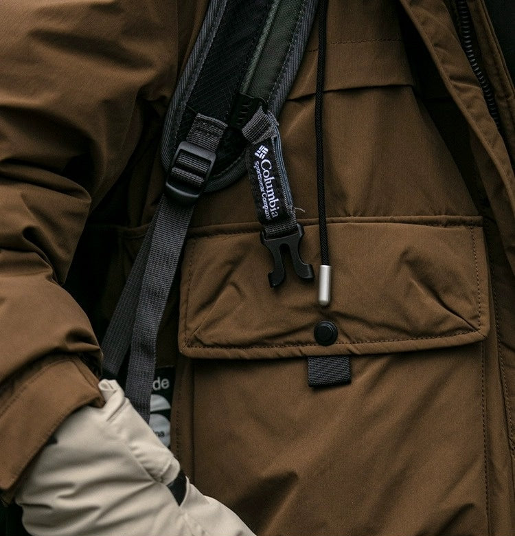 Oversized corduroy hooded down jacket in black and brown colorways with multi-pocket design