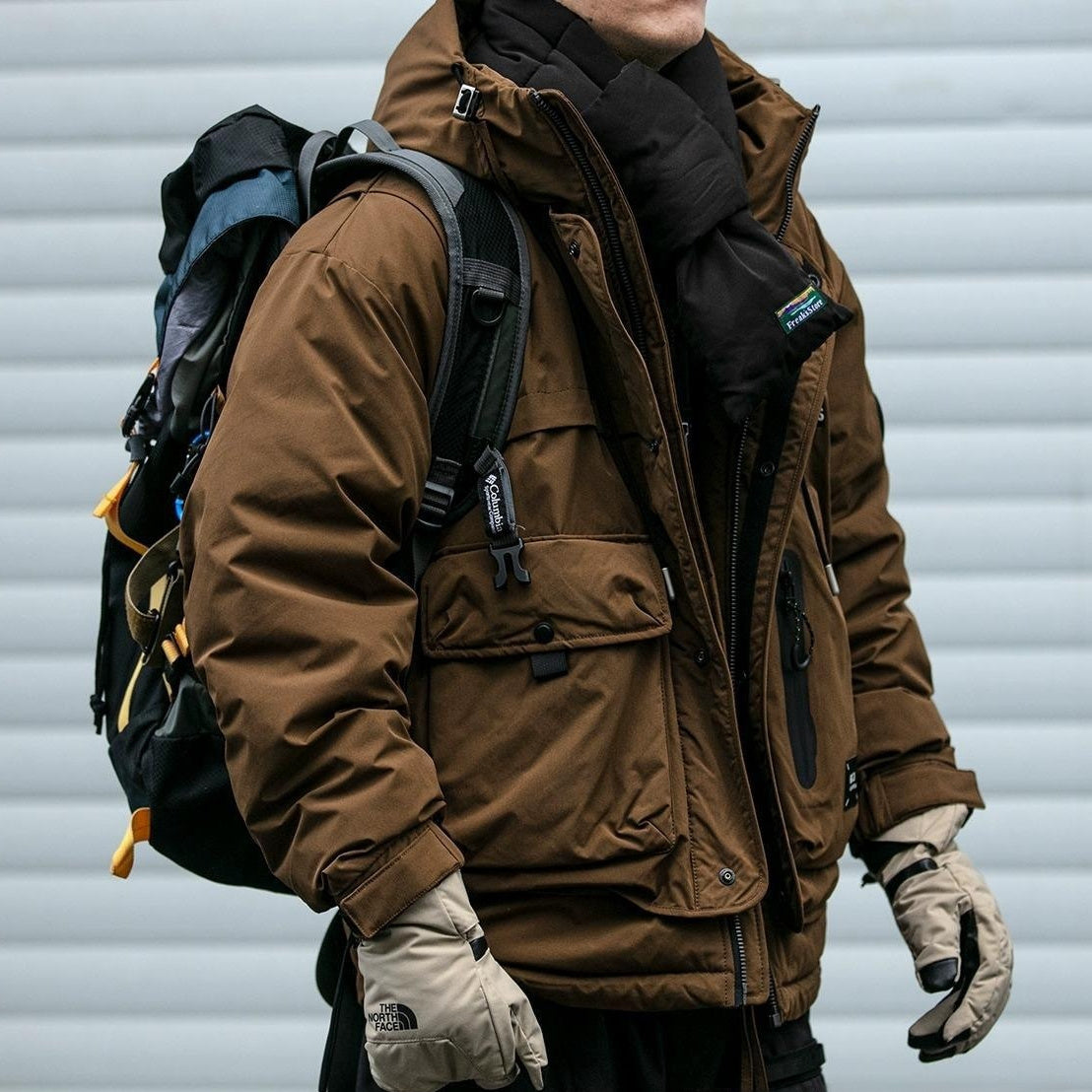 Oversized corduroy hooded down jacket in black and brown colorways with multi-pocket design