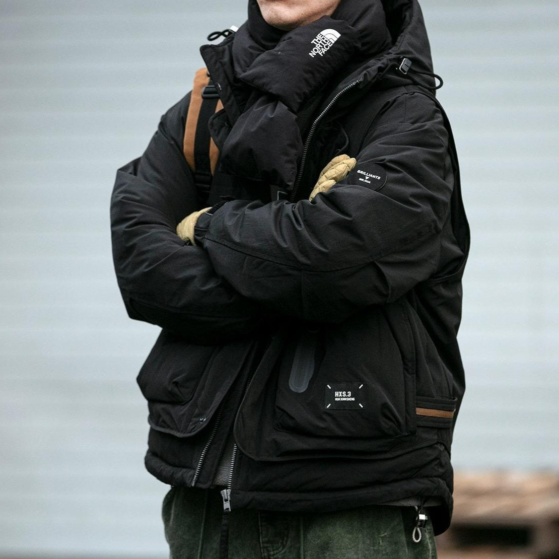 Oversized corduroy hooded down jacket in black and brown colorways with multi-pocket design