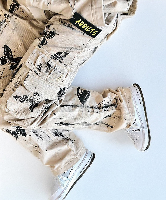 Wide leg cargo trousers with ink splatter and butterfly print